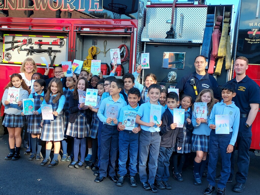 This image has an empty alt attribute; its file name is Fire-Fighters-visit-St.-Theresa-School-Students.jpg